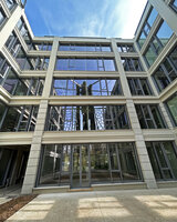 Colonnes Symbiose at Mutualité Française, Paris, renovation by Rudy Ricciotti, reflection in glass façade