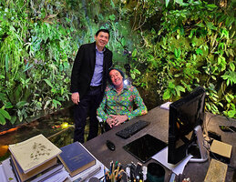 Lee Seow Hiang, CEO of Changi Airports with Patrick Blanc at green and aquatic surrounded desk in Patrick&#039;s home, the main inspiration for the Changi T 2 expansion and refurbishment, March 2019