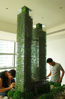 Le Nouvel, Kuala Lumpur, men working at the model