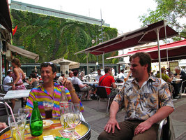 Pascal Heni and Sylvain Bidaut taking a drink on the public place in front of the vertical garden covering the 5 storey car parking, Avignon, France, 2006
