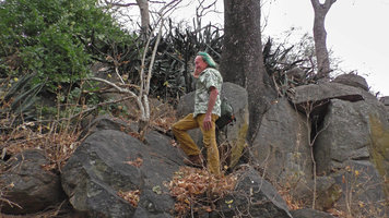 Patrick Blanc among the big boulders to reach a clump of Sansevieria metallica, South Luangwa NP, Zambia, Sept.2017