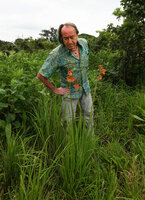 Patrick Blanc and Gladiolus dalenii in woodland savanna, Katavi NP, Tanzania, Jan. 2021