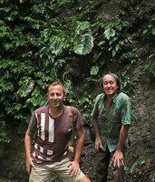 Patrick Blanc and Pascal Heni in front of a seeping cliff covered by the macrocotyledon of a huge Monophyllaea species, Sarambu Sikore waterfall, Tana Toraja, South Sulawesi, June 2019