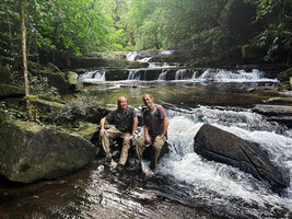 Patrick Blanc and Pascal Héni on the rock slabs of the fast flowing river habitat of the rheophytic Curcuma albiflora, Makandawa, Kitulgala, Sri Lanka, Nov. 2024