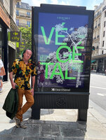 Patrick Blanc and the poster announcing the exhibition Vegetal by