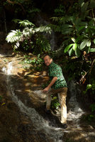 Patrick Blanc ascending the granitic rocks of a waterfall partly covered by the rheophytic Piptospatha perakensis, Fraser&#039;s Hill, Malaysia, Dec. 2016