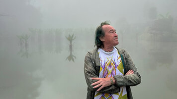 Patrick Blanc at dusk in front of a forest lake filled with Typhonodorum lindleyanum, Andasibe, Madagascar, Aug. 2024