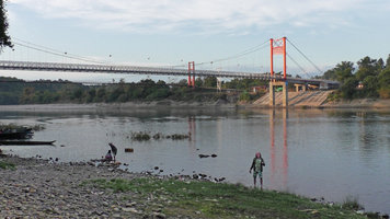 Patrick Blanc at sunset behind a Cryptocoryne cruddasiana patch, Machanbaw, Putao, Myanmar, Dec. 2017
