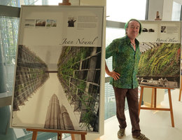 Patrick Blanc between the posters presenting Jean Nouvel and himself inside the Towers covered by 230 climbing plant species, Kuala Lumpur, Aug. 2018
