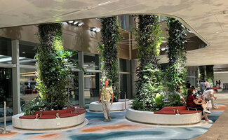 Patrick Blanc checking the green columns at the Arrrival level, Changi airport, Terminal 2, Singapore, July 2022