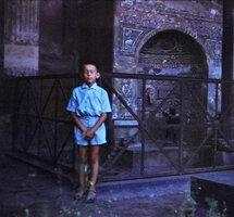 Patrick Blanc closing his eyes in front of a religious sanctuary, Italy, Aug. 1961