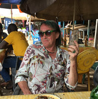 Patrick Blanc drinking a beer at Edea, Cameroon, March 2018