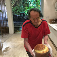 Patrick Blanc during the Covid containment preparing a soufflé for Pascal, in front of their home vertical garden, March 2020