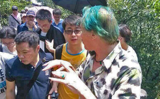 Patrick Blanc explaining the growth habits of plants to university students during a field trip in Dayang Shan, Suzhou, China, May 2014