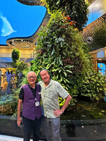 Patrick Blanc explaining to Gary Gan, a Volunteer Ambassador, the concept and the plant species diversity in the Dreamscape garden, Changi T2 airport, Singapore, April 2025