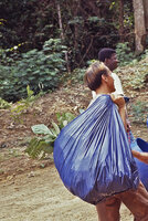 Patrick Blanc holding a bag of botanical samples including Cercestis camerunensis during the Canopy Raft expedition, Ebodjé, Campo, Cameroon, Nov. 1991