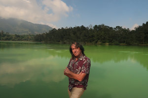 Patrick Blanc in front of a bright green volcano lake, Dieng, Wonosobo, Java, May 2018