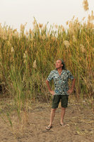 Patrick Blanc in front of Phragmites australis population, a form with rigid spiny leaves, Ndole Bay, Tanganyika lake, Zambia, Sept. 2017