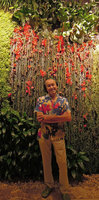 Patrick Blanc in front of the red flowering Columnea arguta, Sofitel Palm Jumeirah, Dubai