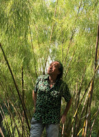 Patrick Blanc in the dappled shade of Otatea acuminata, Val Rahmeh Botanical Garden, France, Aug. 2020