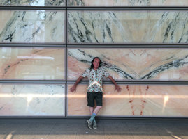 Patrick Blanc laying against a marble façade, Singapore, Aug. 2016