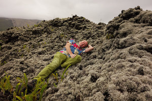 Patrick Blanc laying on an old lava flow covered by the silver lichen Stereocaulon vulcani and some erect Nephrolepis abrupta, Sainte-Rose, La Reunion, Oct. 2015