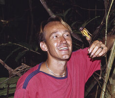 Patrick Blanc looking at a flower of Aristolochia macrocarpa, Campo, Cameroon, Nov. 1991