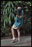 Patrick Blanc looking at Iris japonica on his outdoor vertical garden, Creteil, France, June 1998