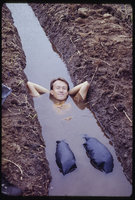 Patrick Blanc lying in a ditch, Sumatra, Indonesia, May 1983