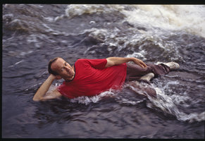 Patrick Blanc lying in the swift running water habitat of Podostemonaceae, Cameroon, 1991