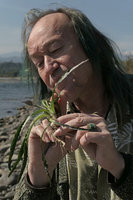 Patrick Blanc observing a flowering individual of Cryptocoryne cruddasiana along the Malikha river, Putao, Kachin, Myanmar, Dec. 2017