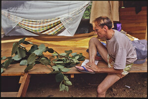 Patrick Blanc observing a sample of a male Piper guineense, Canopy Raft expedition, Campo, Cameroon, 1991