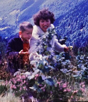 Patrick Blanc observing blooming Rhododendron ferrugineum with his mother, Innsbruck, Tyrol, Austria, Aug. 1959