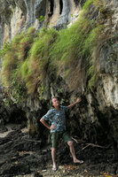 Patrick Blanc observing grass clumps growing on vertical limestone cliff along sea shore, Railay, Krabi, Thailand, March 2017 [nid: 13240]