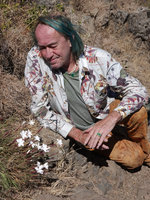 Patrick Blanc observing the bright white flowers of Dianthus longiglumis, Simien NP, Ethiopia, Jan. 2019