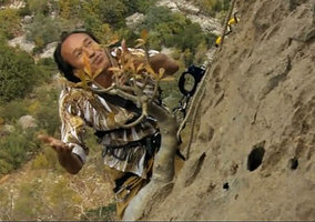 Patrick Blanc on a vertical cliff, explaining the growth habits of Dorstenia gigas, Socotra, March 2005
