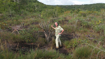 Patrick Blanc on  rock slabs among old Vellozia tubiflora individuals, Cano Cristales, Meta, Colombia, Oct. 2016