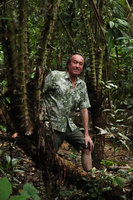Patrick Blanc on stipe of the spiny palm Eleiodoxa conferta, Khao Lak Lam Ru NP, Thailand, June 2019