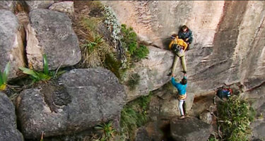 Patrick Blanc reaching a very narrow ledge while ascending a vertical cliff of the Kukenan Tepui, Venezuela, March 1999