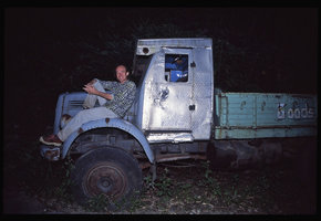 Patrick Blanc sitting at night on an old lorry, Darjeeling, India, Sept. 2002