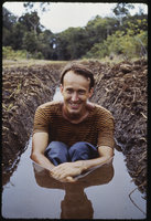 Patrick Blanc sitting in a ditch, Sumatra, May 1983