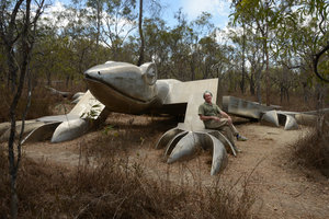 Patrick Blanc sitting on the foreleg of the Giant Lizard stainless steel sculpture by Mitsuaki Tanabe, Mareeba Wetlands Reserve, Queensland, Australia, Nov 2012