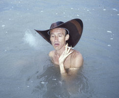 Patrick Blanc smoking while bathing, Penang, Malaysia, July 1987