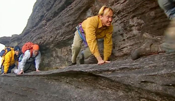 Patrick Blanc somewhat affraid when moving along a very narrow ledge while ascending the Kukenan Tepui, Venezuela, March 1999