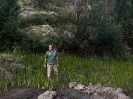 Patrick Blanc standing in a population of Acorus verus in a marshy area at the base of Mt Ramelau, Timor-Leste, Aug.2026