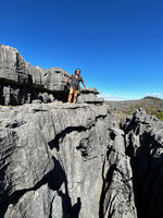 Patrick Blanc standing on a narrow karst ledge, Ankarana Tsingy NP, Madagascar, Aug. 2024