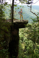 Patrick Blanc standing on overhanging stone platform, Khao Yai NP, Thailand, June 2016