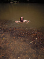 Patrick Blanc swimming and reaching a Cryptocoryne nurii population in a swift running river, Endau Rompin, Malaysia, April 2015