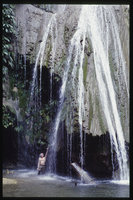 Patrick Blanc under a calcareous cascade with Dicranopygium, El Jaguar Barquisimeto, Venezuela, March 1999