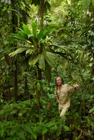 Patrick Blanc under a climbing Asplundia with huge leaves crowded at the upper part of stem, Utria NP, Choco, Colombia, Nov.2016